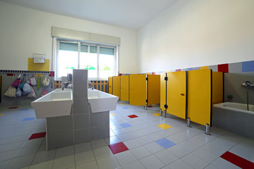 bathroom nursery with ceramic sinks and bath