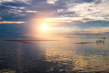 THAILAND, Jule - 12, 2014. People are standing in the sea at sunset in Koh Samui