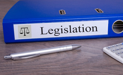 Legislation binder with pen in the office