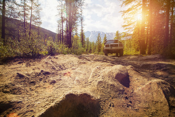 Offroad in wild mountains. Large rocks on the road, extreme travel adventure in nature © Annatamila