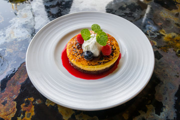 Rasberry pancakes with jam on plate
