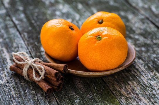 Fresh oranges on a wooden table
