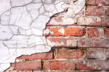 ragged stucco on brick wall