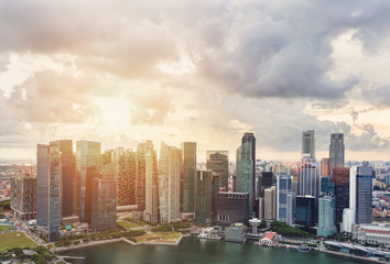 Business city urban skyline sunset. Singapore skyscrapers in downtown, cloud sky, sunlight