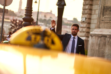 Young businessman with a taxi  