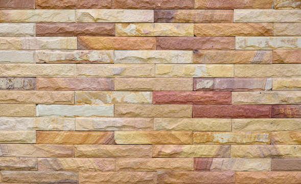 Exterior sandstone Brick Wall texture background pattern color