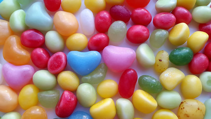 Little colorful candy hearts background.