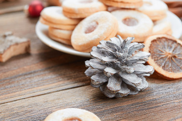 Fototapeta premium Pile of cookies on white plate on a wooden table