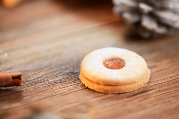 Single christmas cookie on a brown wooden table