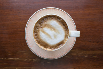 Close up white cup of Coffee, latte on the wooden table