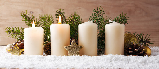 Two burning advent candles and Christmas decoration.