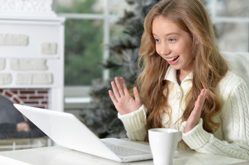 Surprised girl with laptop