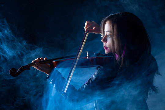 Rock Woman with Leather Jacket Playing a Violin