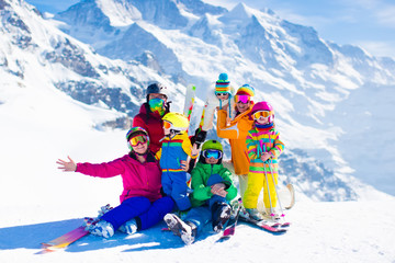 Ski and snow fun. Family in winter mountains.