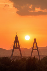 Sunset on a modern Megyiery bridge in Budapest, Hungary over Dan