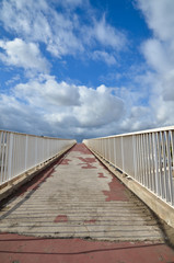 Upwards an old footbridge