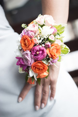 Wedding bouquet on a brides hand