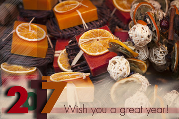 Winter holidays greeting card for 2017 to come. Descrete Blurry background with seasonal winter spice decorations.