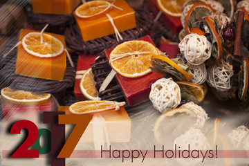 Winter holidays greeting card for 2017 to come. Descrete Blurry background with seasonal winter spice decorations.