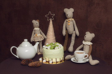 Teddy bears, green pistachio cake with macaroons and marshmallows