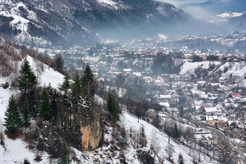 winter in romanian Carpathians mountains in a cloudy day. Pestera, Magura, Bran, Brasov. winter season 20015 / 20016