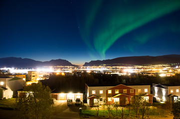 Naklejka na ściany i meble Northern lights over Tromso in Northern Norway