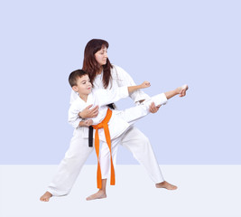 Coach teaches the athlete to hit a kick