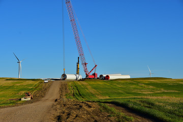 construction of towers for wind tubines, part of another wind farm to generate clean energy in ND.