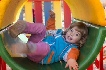 Fototapeta na wymiar Little Girl Playing At Playground