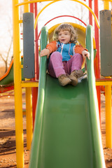 Fototapeta na wymiar Little Girl Playing At Playground