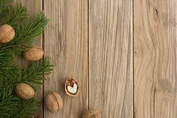 Fototapeta na wymiar Christmas trees and nuts on a wooden table