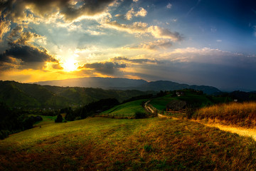 Fototapeta na wymiar Evening, sunset on mountain hills of Simon village. Bran.