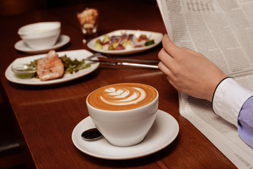 Cup of morning coffee on worktable