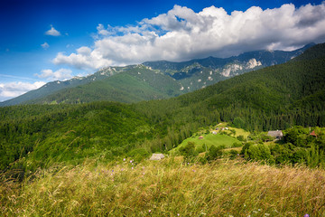 Evening, sunset on mountain hills of Simon village. Bran.