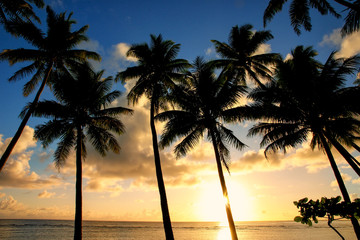 Fototapeta na wymiar Colorful sunrise on the beach in Lavena village in Taveuni Isla