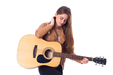 Young woman holding a guitar 