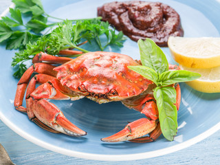 Cooked crab with lemon and herbs.