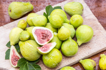 Ripe fig fruits on the wooden table.