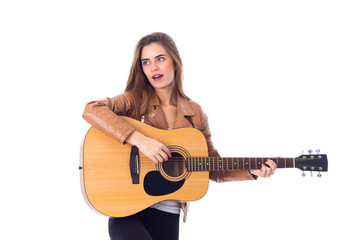 Young woman holding a guitar 