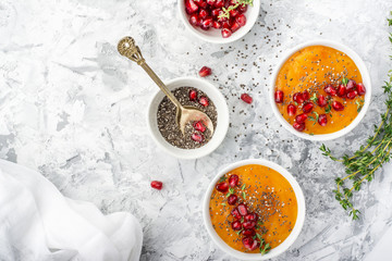 Detox and healthy breakfast with seasonal fruits, milk, chia seeds, pomegranate   herbs on a gray marble background. Top view. The concept of  organic natural food.