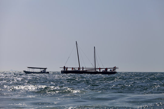 Silhouette of racing traditional dhow in the Arabian Gulf, off Abu Dhabi