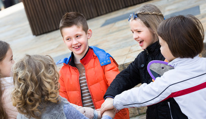 Outdoor portrait of junior school kids .