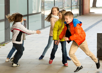 Children playing romp game Touch-last
