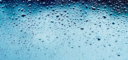 Rainy wet cold blue sky eco seasonal natural background with water drops
