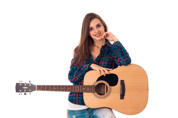 charming brunette girl playing guitar