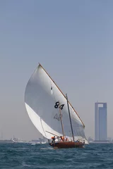 Zelfklevend Fotobehang Traditional sailing dhows race back to Abu Dhabi at Ghanada Dhow Sailing Race 60 ft. Final Round © Freelancer