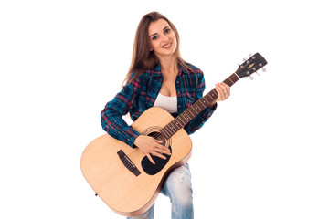 Obraz na płótnie Canvas charming girl with guitar in hands