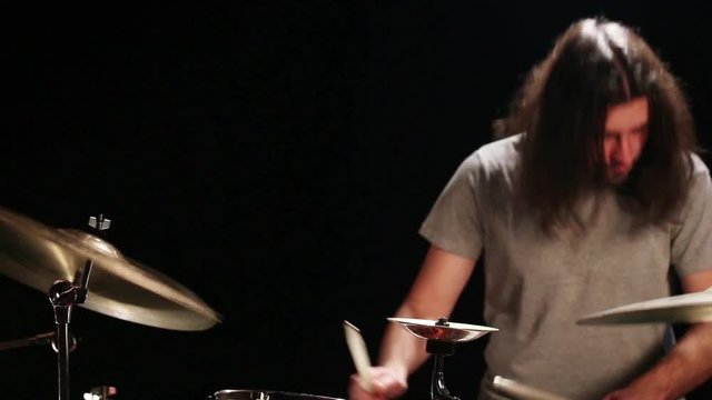Bearded drummer playing drums