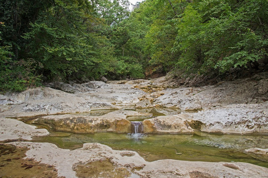 Mountain river in forest and mountain terrain. Crimea.