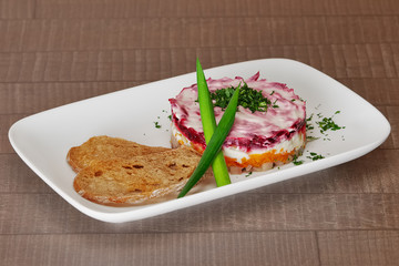 Russian Shuba Salad with Beetroot, Potatoes, Carrots and Herring Studio Photo
